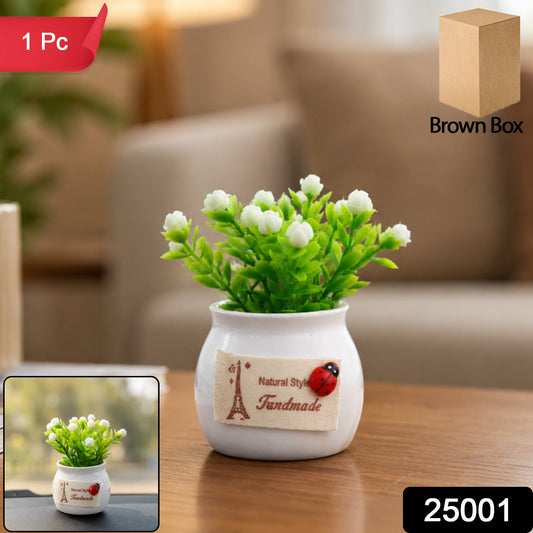 Faux bonsai plant with white flowers in a ceramic pot